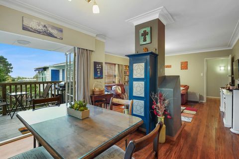 The dining space adjoins the patio and outdoor dining through the french doors.