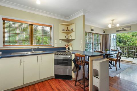 There is a double sink and oven with glass cook top. The breakfast bar seats two.
