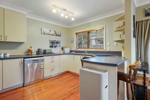 The kitchen is large and bright with plenty of storage.