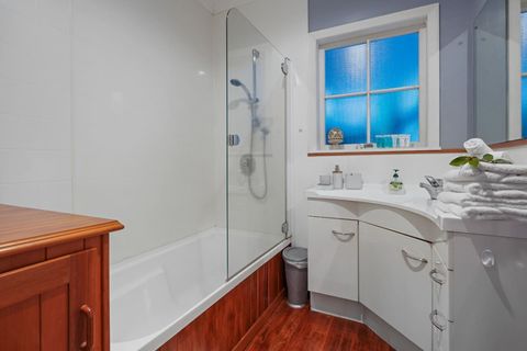 The bathroom has a shower over a bathtub. You can choose and use your preference. We provide hotel quality bath towels, face cloths, hand towels and foot mats. We also provide complimentary shower gel, shampoo and conditioner.