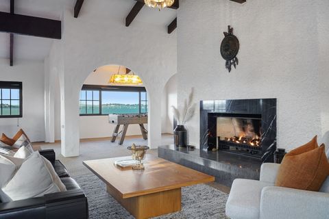 There is a games alcove by one of the windows with a foozball machine.