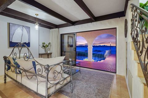 The daybed/settee in the foyer at the base of the stairs.