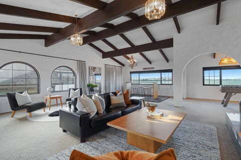 This shows the size of the room and the multiple seating areas.