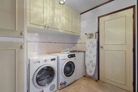 The full in-house laundry with front-loading washing machine and dryer. We provide the complimentary washing powder. There is also an iron, ironing board and laundry tub if you require them.