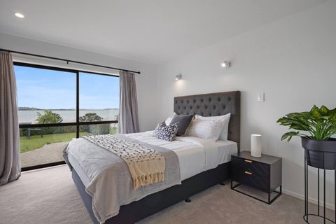 Bedroom 3 has a lovely sea view with a ranch slider.