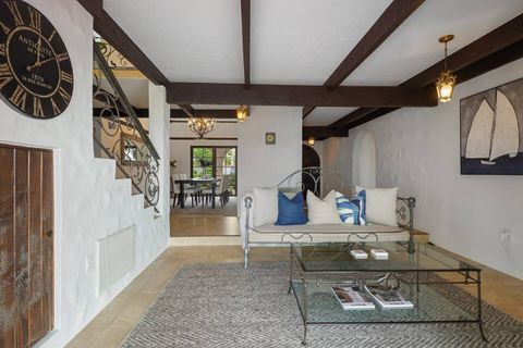 This is another lounge space at the foot of the stairs that serves as an entry to the stairs, dining room, and central courtyard.
