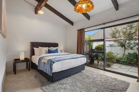 Bedroom one on the groundfloor with a ranchslider and private garden view.