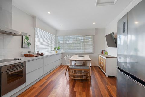 The large kitchen and dining room has plenty of storage and bench prep space.