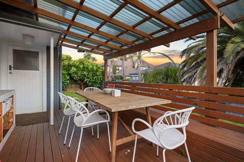 The covered ground floor outdoor living area and dining space.