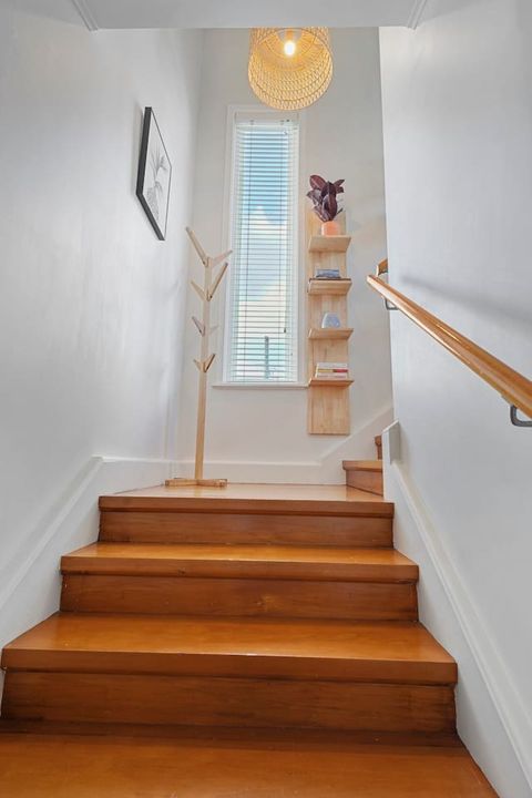 The beautiful wooden staircase is epic in its proportions.
