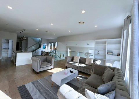 Plenty of seating in the living room is on the comfy Chesterfield-style sofas and chairs.