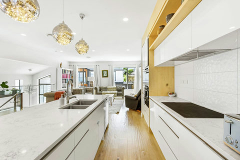 The large kitchen has plenty of prep space to cook meals during your stay.