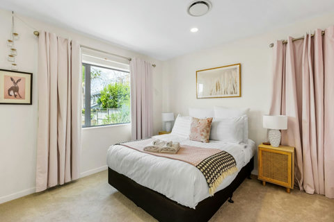 Bedroom four is a lovely feminine room with its pink accents throughout.