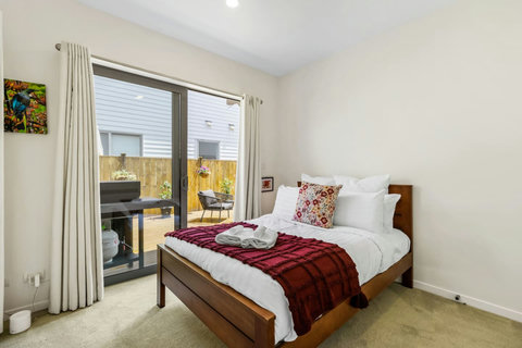 Bedroom two has a queen-sized bed and opens onto the patio area.