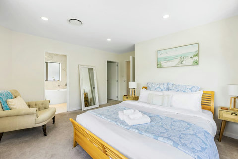 The main bedroom suite has a walk-in wardrobe and ensuite bathroom.