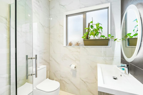 The two other bathrooms have a shower, toilet and vanity unit. There is one upstairs and one downstairs.