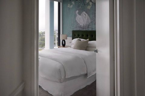 Bedroom two has an exquisite bird-themed mural.