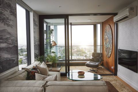 There is interesting wallpaper and pictures throughout this apartment.