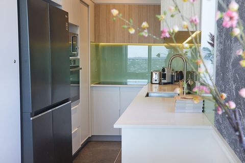 Modern galley-style kitchen with all the appliances you need to create meals.