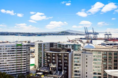 View of the Inner harbour and Devonport and the Naval base with Rangitoto Island in the background.