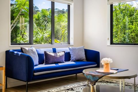 Enjoy the sun that streams through the window onto the sofa in the sun room.