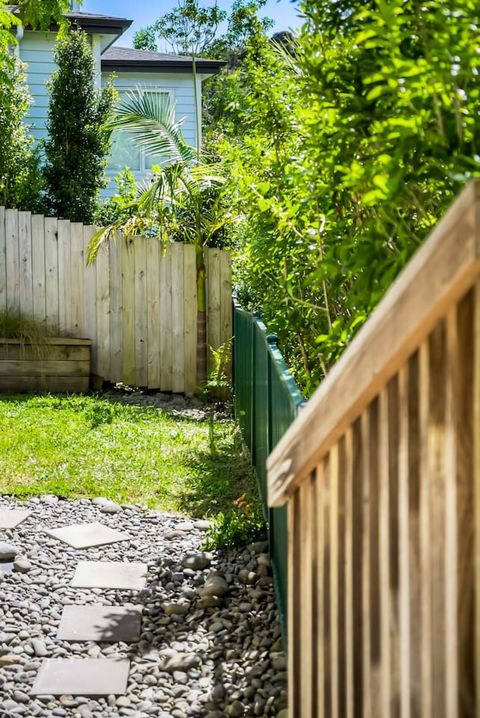 There is a set of stairs from the patio to the grass.