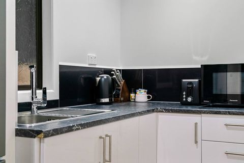 There is a convection microwave, portable two burner stove and a fridge/freezer.