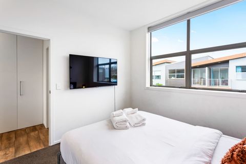 There is a wall-mounted tv for you to enjoy.