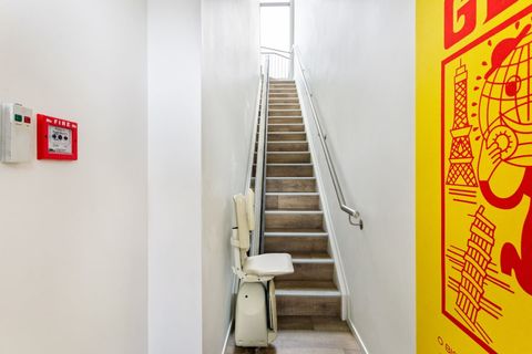 The entry stairs up to the unit.