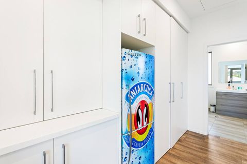 The fancy fridge adjoining the kitchen.