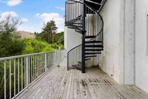 The spiral stairs down to the balcony.