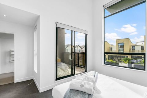 The main bedroom has an ensuite bathroom and a private opening onto the deck area.