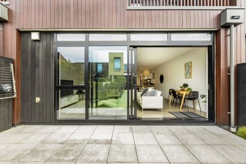 The bifold ranch slider opens up to connect the inside and outside and expand the living spaces.