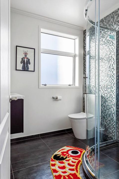 There is plenty of space in the bathrooms for toilets, a shower cabinet, and a sink with a mirror.