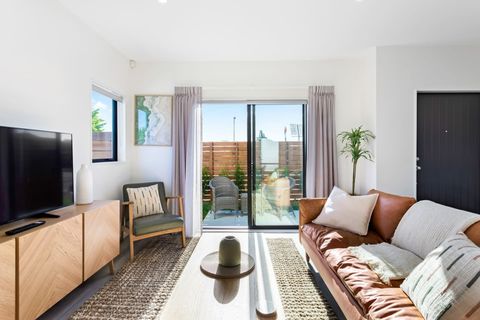 The living room has a ranch slider opening onto the patio.