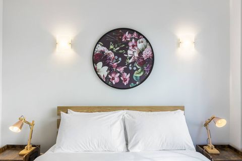 Splashes of colour are introduced in the artwork around the apartment.