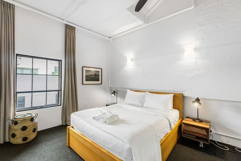 Bed 1 is in the sleeping alcove of the open-plan living area.