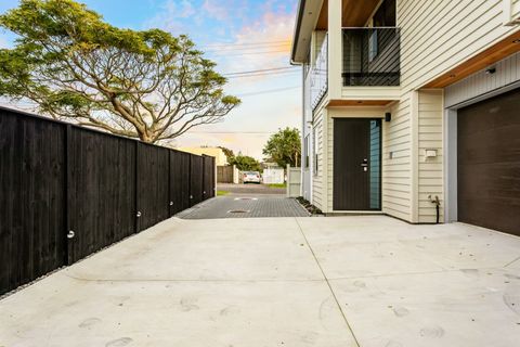The front door and entry to the garage. Off street parking for one car.