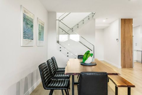 You can look down from the glass-fronted stairs to the dining area.