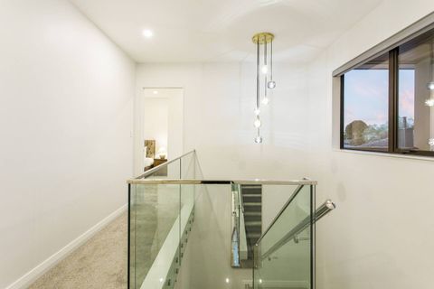 The stairs up to the four bedrooms.