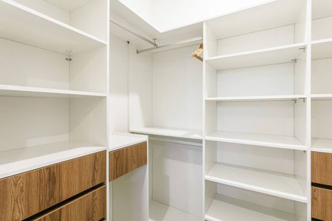 The large walk-in wardrobe of the primary suite.