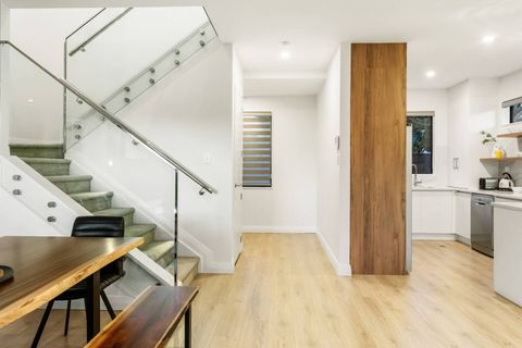 The stairs and the powder room are ahead on the left.