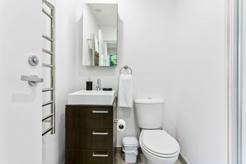 Ensuite bathroom with heated towel rail and shower.