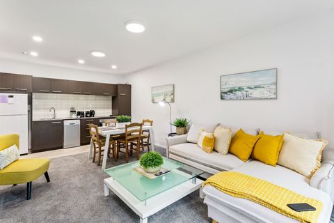 The pops of yellow provide a warm, welcoming space to relax.