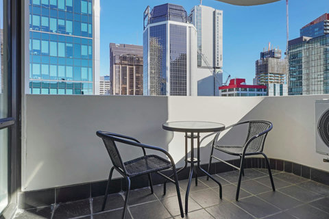 Relax with your morning coffee on this lovely balcony area with great views of the city.