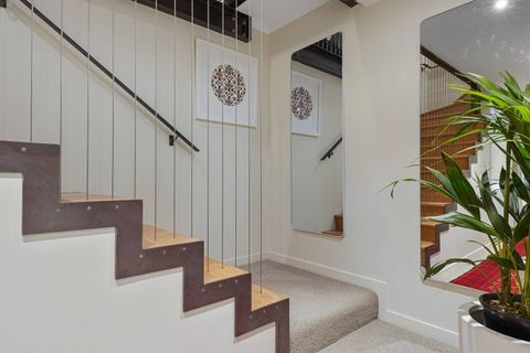 The stairs from the main living level to the downstairs bedrooms.