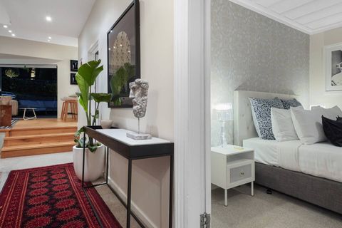 Located at the front of the house on the entry level, this queen bedroom has been lovingly renovated.