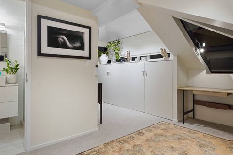 There is plenty of closet space in this suite. The ensuite bathroom is to the left.