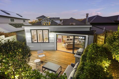View from the top deck towards the house at dusk, watch the sun set in the horizon.
