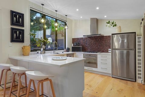 With not only room for wine storage and a large fridge and freezer, this kitchen also has the added bonus of a pantry with wine fridge to keep the beverages chilled.